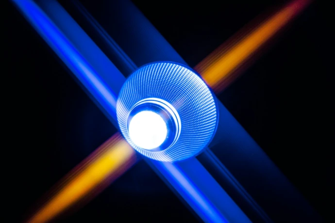 a blue object with a white light in the middle of it